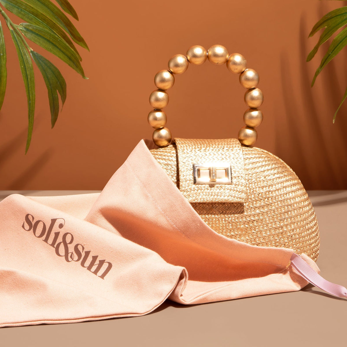 THE ORLA Gold Woven Straw & Wooden Bead Statement Clutch Bag
